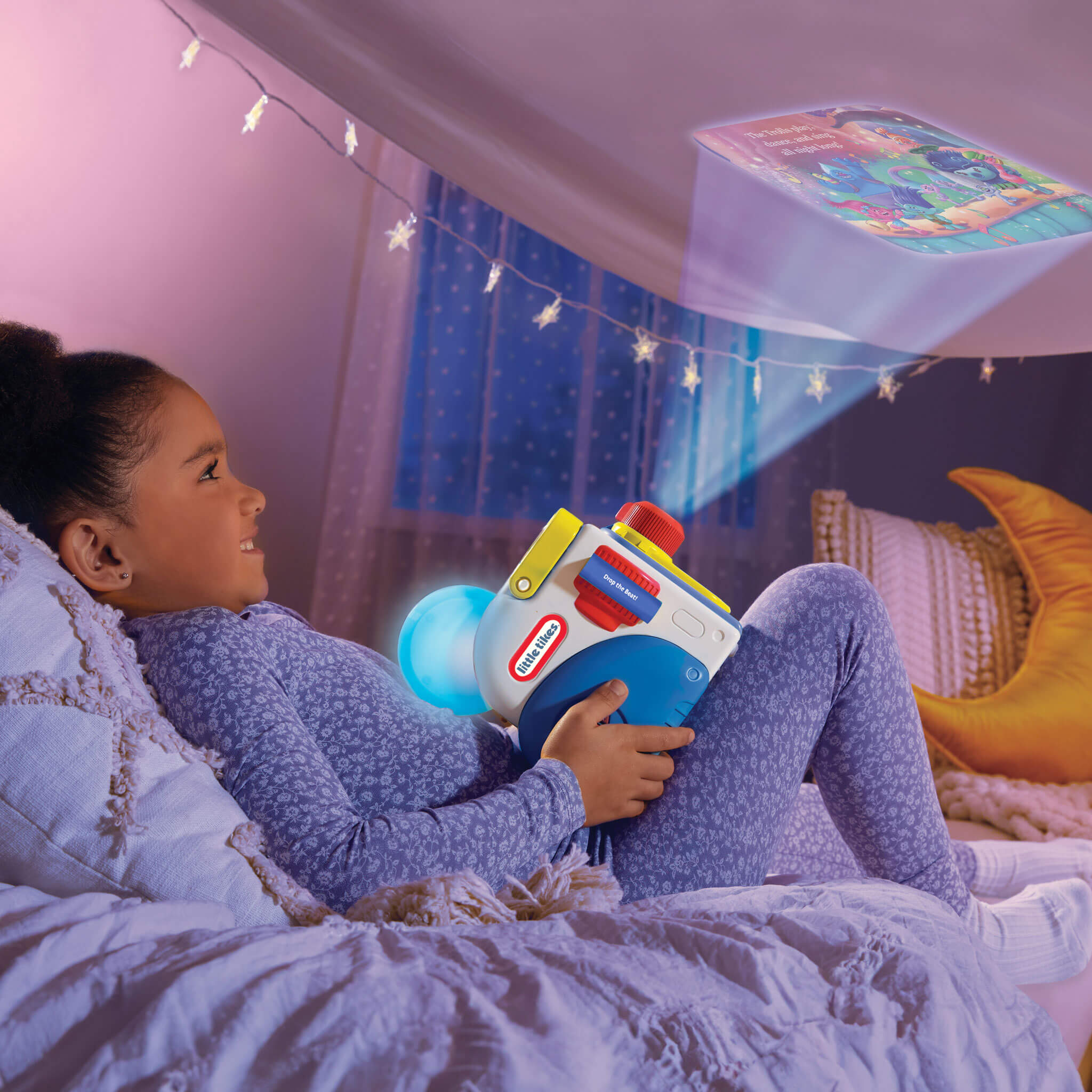 girl projecting Troll story on the ceiling 